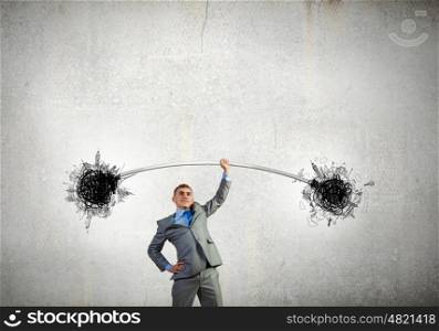 Strong businessman. Young strong businessman lifting barbell on one hand