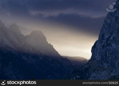 Strong directional beam of light beam in cascade canyon of the Tetons