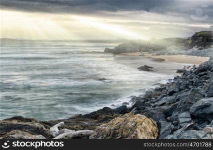 strong fine art image of a dark and dramatic coastline. dramatic coastline