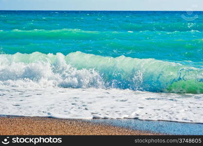 Strong foaming waves and beach