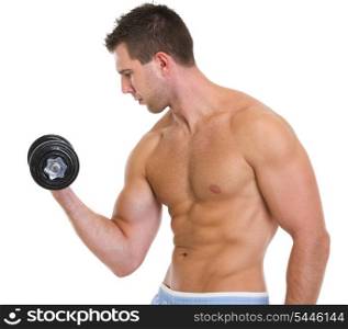 Strong male athlete raising dumbbell