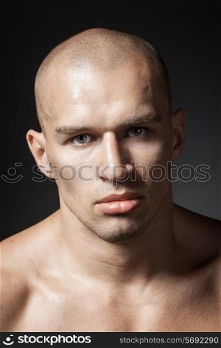 strong man portrait isolated on dark background