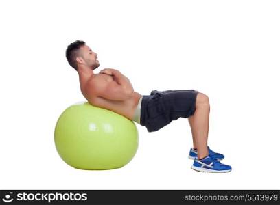 Strong man practicing abdominal on a big ball isolated on a white background