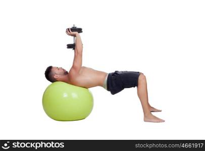 Strong man practicing exercises with dumbbells sit on a ball isolated on white background