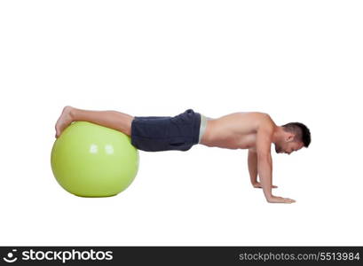 Strong man practicing pushups with a big ball isolated on a white background