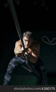 strong man pulling rope