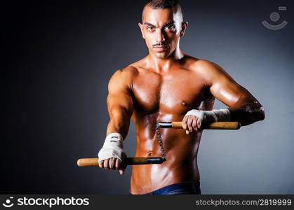 Strong man with nunchaku