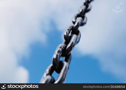 strong steel chain for industry, blue background