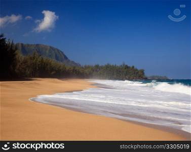 Strong waves crash over the beach at Lumahai on Kauai