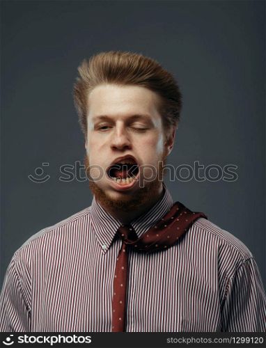 Strong wind blowing in male face, funny emotion. Powerful air flow blows on businessman on black. Strong wind blowing in male face, funny emotion