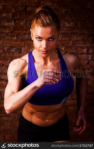 strong woman is running on camera