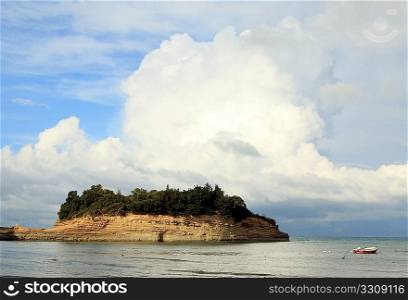 Strongly bedded eroding sandstone formations at Sidari, north Corfu, under a dramatic sky. The popular resort has marketed its sandstone bays as the &acute;Canal d&acute;amour&acute;.