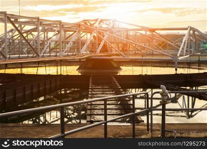 structure frame of water works in heavy industry estate plant agaisnt beautiful sunset sky light