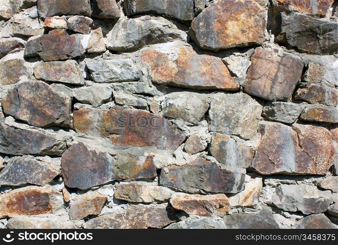Structure of a concrete and stone wall with drawing and various color