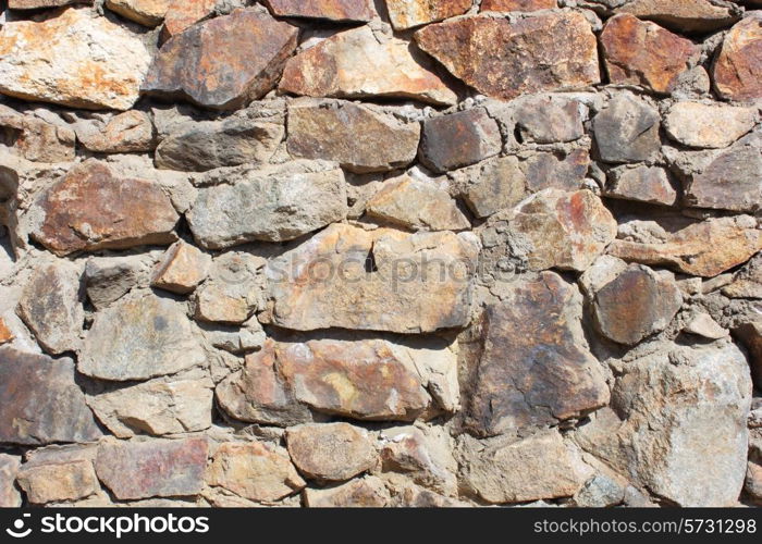 Structure of a concrete and stone wall with drawing and various color