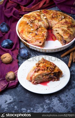 strudel with autumn plum. strudel with plum in the baking tray