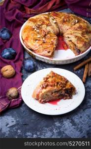 strudel with autumn plum. strudel with plum in the baking tray