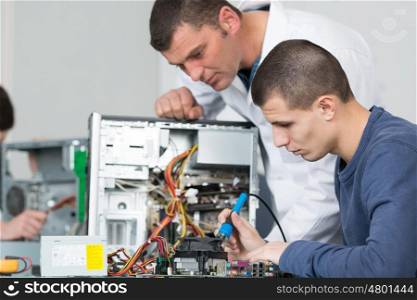student and teacher in electrical engineering course