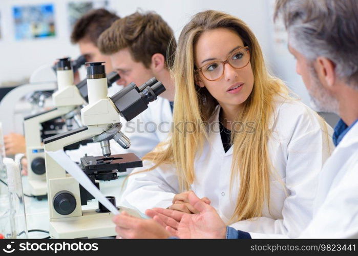 student and teacher science discussion