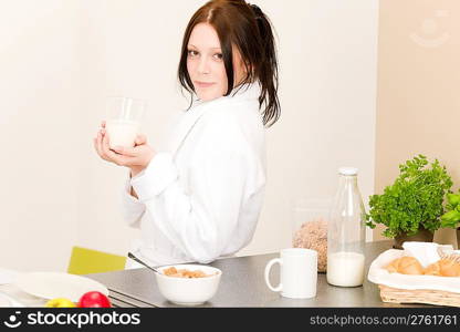 Student apartment - young student girl drink milk for breakfast