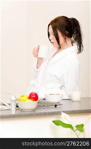 Student apartment - young student girl drink milk for breakfast