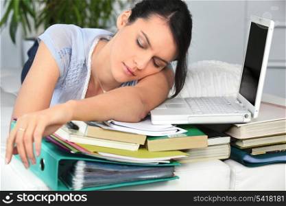 Student asleep next to work
