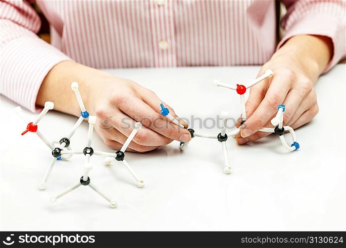 Student assembling molecule models