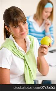 Student at home - happy woman with apple, study together