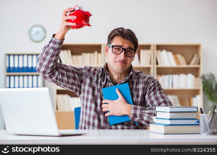 Student breaking piggybank to pay for tuition fees