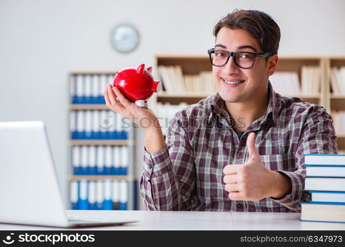 Student breaking piggybank to pay for tuition fees