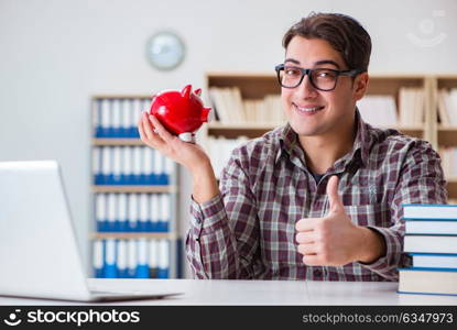 Student breaking piggybank to pay for tuition fees