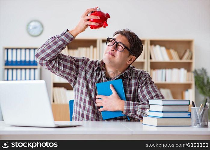 Student breaking piggybank to pay for tuition fees