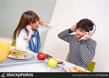 Student cafeteria - teenage couple having fun during lunch break