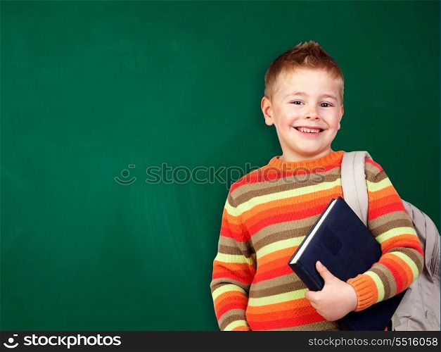 Student child with books isolated over green blackboard