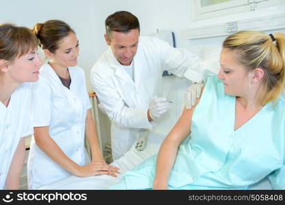 Student doctor performing injection