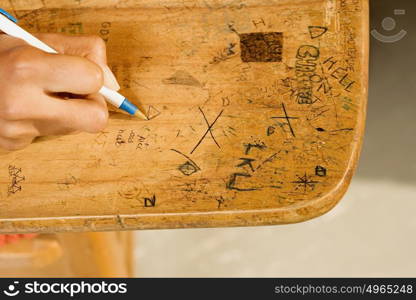 Student drawing on desk