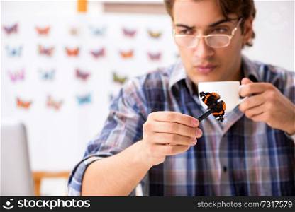 Student entomologist studying new species of butterflies