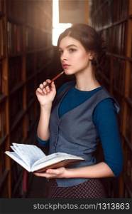 Student girl choose book with pen and notebook in her hands. Vintage library on the background.