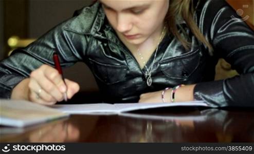 Student girl doing homework.