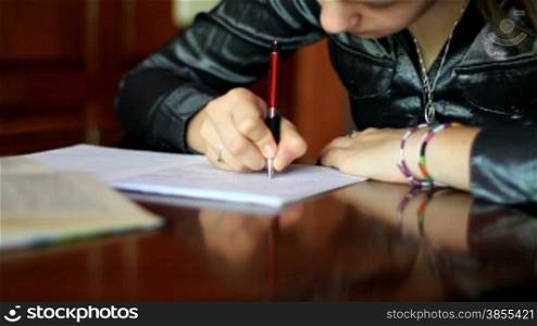Student girl doing homework.