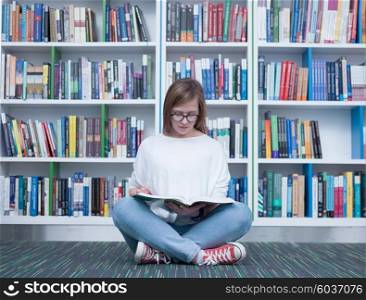 student girl in collage school library reading book