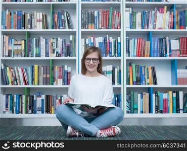 student girl in collage school library reading book