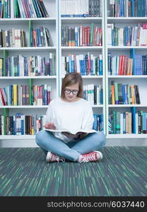 student girl in collage school library reading book