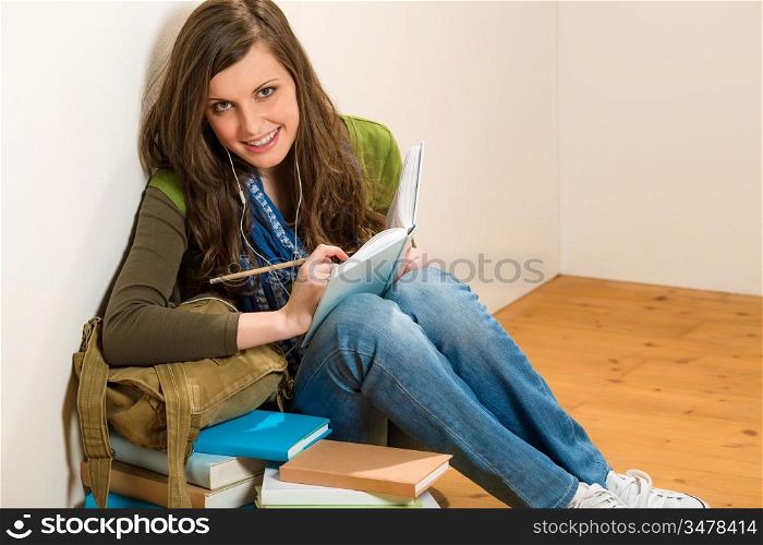 Student girl portrait teenager woman with books listen music
