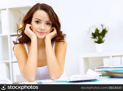 Student girl studying her lessons at home