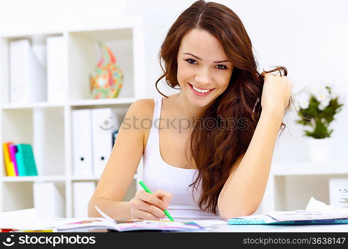 Student girl studying her lessons at home