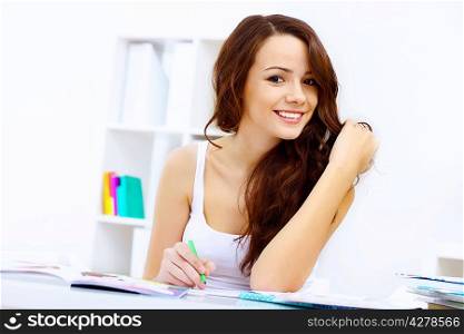 Student girl studying her lessons at home