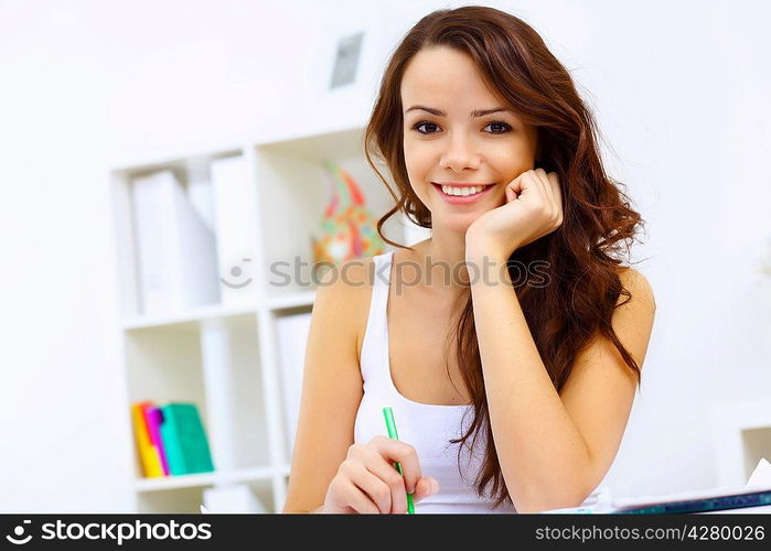 Student girl studying her lessons at home