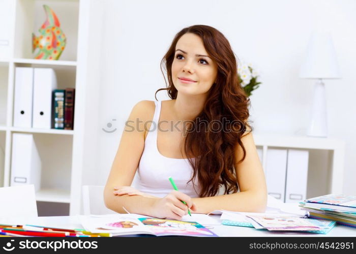 Student girl studying her lessons at home