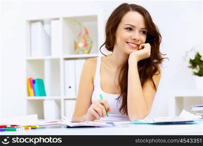 Student girl studying her lessons at home